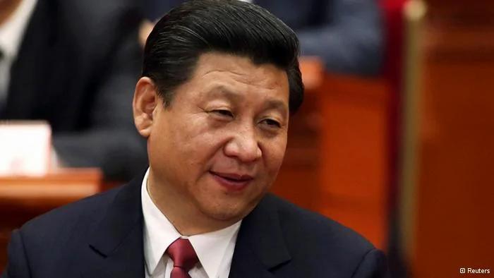 China's newly elected President and chairman of the Central Military Commission Xi Jinping(L) talks with China's Vice Premier Li Keqiang during the fourth plenary meeting of the first session of the12th National People's Congress(NPC) in Beijing, March14,2013. REUTERS/China Daily(CHINA- Tags: POLITICS) CHINA OUT. NO COMMERCIAL OR EDITORIAL SALES IN CHINA